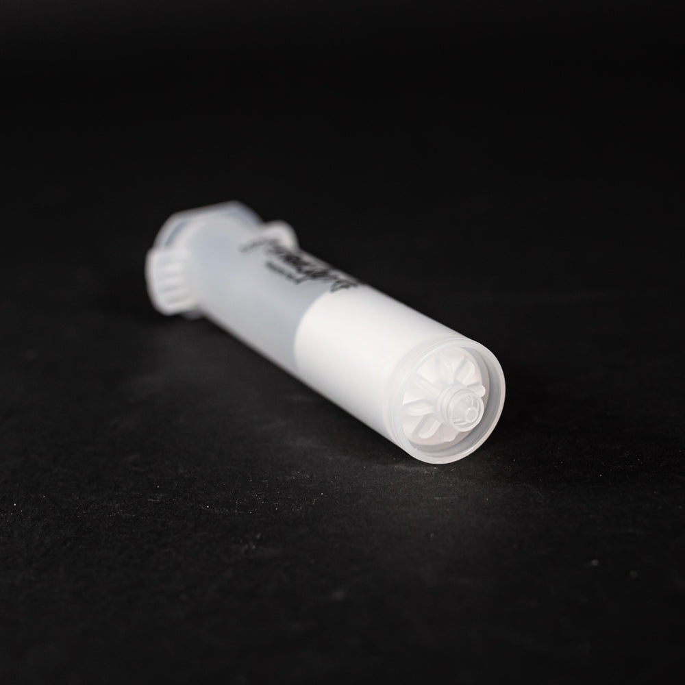 A small clear plastic cartridge displayed on a black background, creating a striking visual contrast between the two elements.