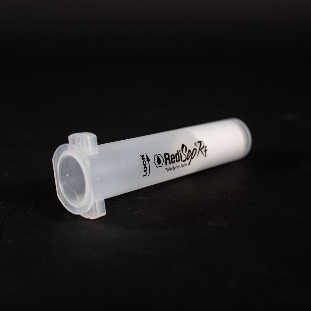 A small clear plastic cartridge displayed on a black background, creating a striking visual contrast between the two elements.